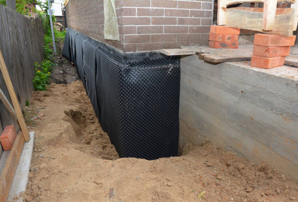 Happy homeowners after waterproofing job in Faulkner